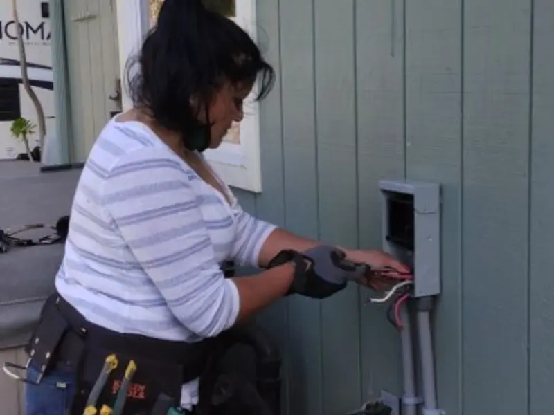Licensed electrician wiring an exterior subpanel in Harborcreek